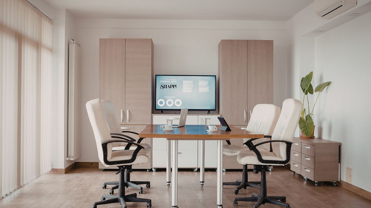 Business meeting with presentation screen